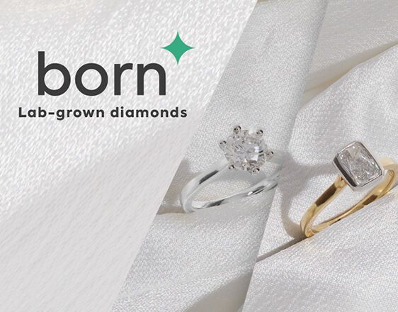 Woman wearing Born lab-grown diamond engagement rings and earrings, sustainable fine jewellery collection